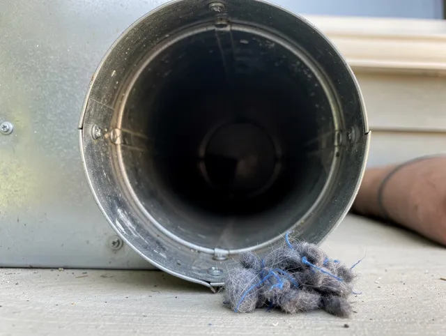 Walnut Park Dryer Vent Cleaning technician using specialized equipment to clear severe dryer vent blockage in Walnut Park